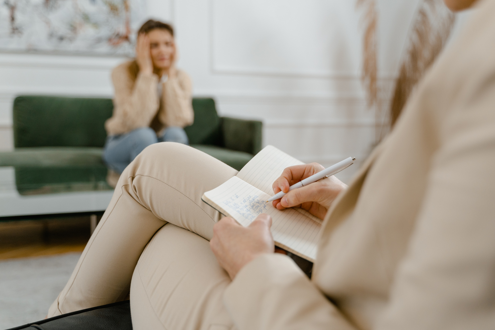 Woman in Beige Coat Reading Book