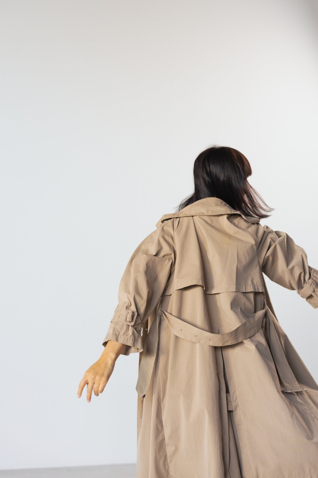 Back View of Person Wearing Brown Trench  Coat 